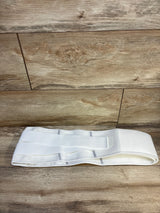 White adjustable maternity support belt on wood background
