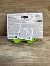 Back view of Bright Starts Safari Driver take along musical toy in packaging, showing green toy wheels on a wood surface