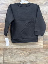 Black long sleeve toddler sweatshirt on wood background, gently used kids clothing