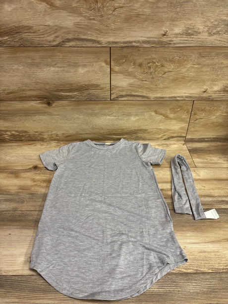 Top down view of a Shein two piece shirt dress and headband set in gray on a wood background
