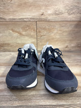 Front view of Cat & Jack Jax toddler sneakers, navy blue lace-up with white midsole, on wood floor