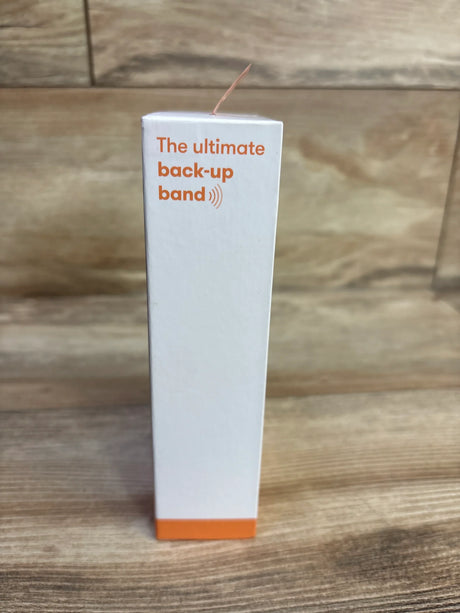 Side view of Frida Mom anti-nausea bands 2-count box with orange accent and text The ultimate back-up band on wood background