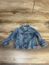 OshKosh kids blue denim jacket with button front on wood background
