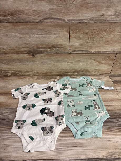 Two baby bodysuits from Me n Mommy To Be in white and light green with dog prints.