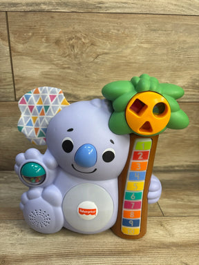 Front view of Fisher-Price Linkimals Counting Koala showing numbered 1-10 buttons, shape-sort tree, patterned fabric ear
