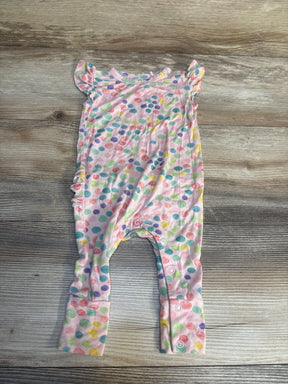 Colorful polka dot baby romper with ruffled sleeves on wood background