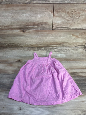 Flat lay of Baby Gap pink embroidered toddler dress size 18-24 months showing floral embroidery on wooden background