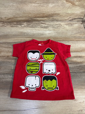 Red toddler Halloween shirt with cute monster faces, perfect for kids' costume parties and fall fun.