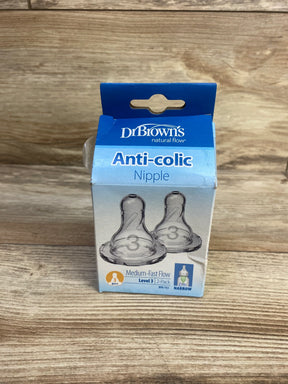 Front view of Dr. Brown's anti colic nipple 2 pack showing Level 3 medium fast narrow flow on wooden background