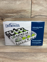 Front view of Dr Brown's boxed dishwasher basket showing white and black basket inserts holding narrow baby bottle parts on wood background