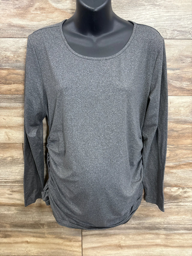 Gray long sleeve maternity shirt with ruched sides on a mannequin against wood background
