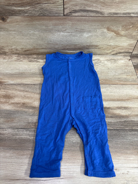 Front view of Kyte Baby sleeveless bamboo snap jumpsuit in blue, showcasing front snaps and pocket on a wood background