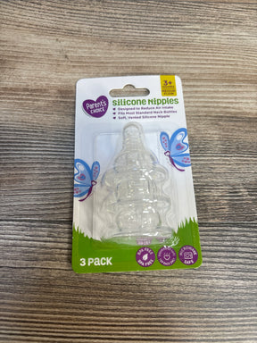 Parent's Choice silicone nipples 3 pack, BPA free, for standard baby bottles, on wood surface.