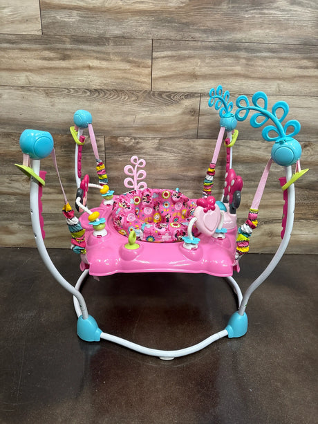 Front view of Disney Baby Minnie Mouse PeekABoo activity jumper in pink and turquoise with patterned seat and attached toys