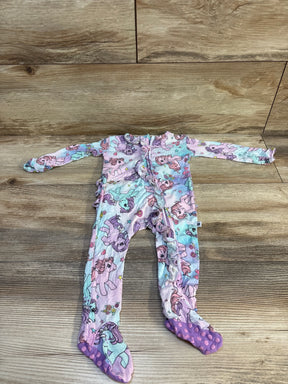 Flat lay of lilac newborn footie with My Little Pony ombre cloud print, front ruffle zipper, purple gripper soles on wood