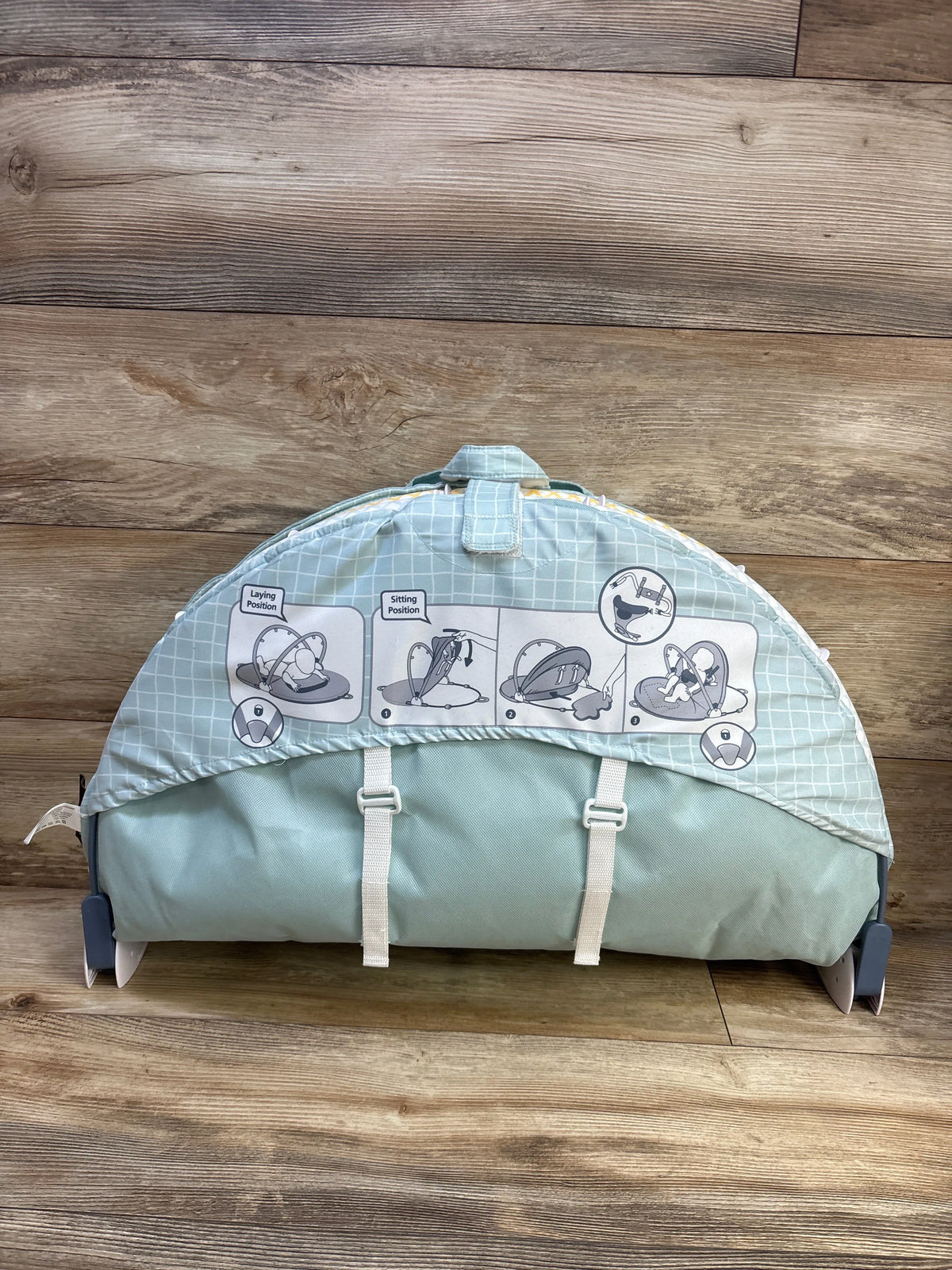 Folded Yookidoo 3-in-1 Urban Gymotion Lay to Sit-Up Play Mat showing position instructions and securing straps