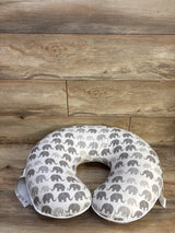 Top-down view of Boppy nursing pillow showcasing gray elephant-pattern slipcover with wood plank background