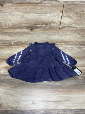 Flat-lay of Art Class black wash 2pc dress 12m showcasing ruffle shoulders and tie-dye long sleeves on wood background