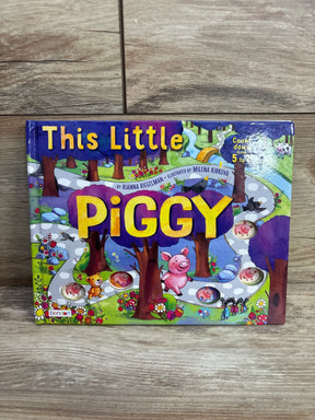 Front view of This Little Piggy board book with colorful cover, title and five counting peek through holes on wood floor