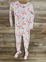 Colorful baby footed pajamas with dinosaur and floral print, long sleeve, zip front, on wood floor