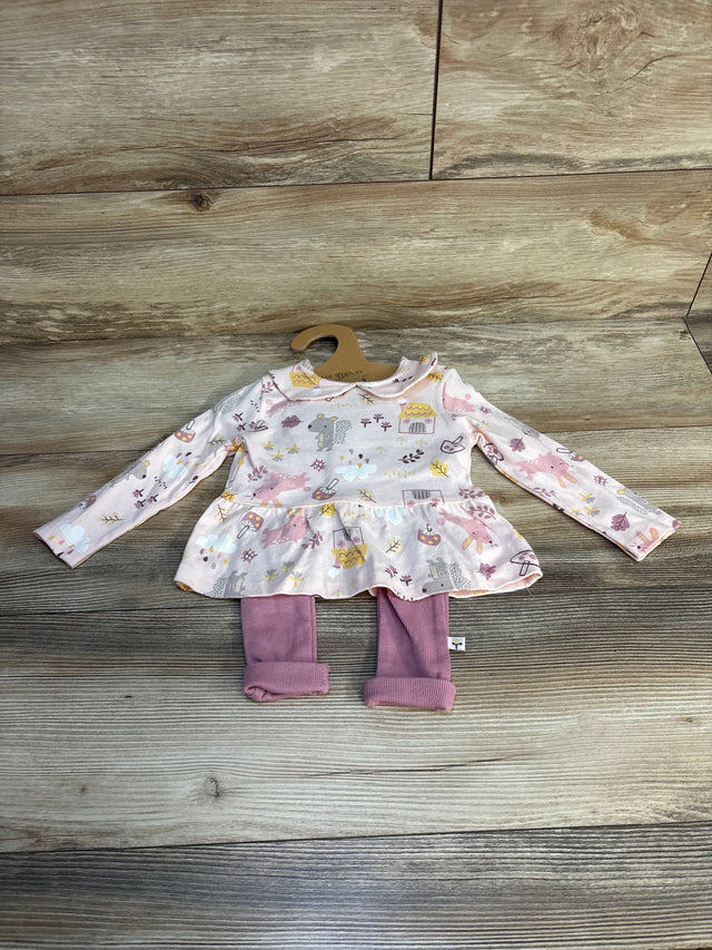 Girls' long sleeve dress with animal print and pink leggings set on wood background