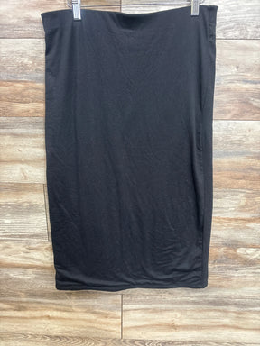 Black maternity skirt hanging on wooden wall background, part of kids and maternity resale clothing