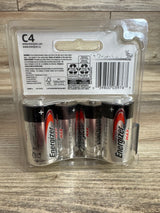 Front view of 4-pack Energizer Max C alkaline batteries in clear plastic packaging on wood background