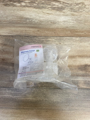 Top-down view of Maymom wide-mouth 19mm breast pump flanges in sealed clear plastic package on wood tabletop