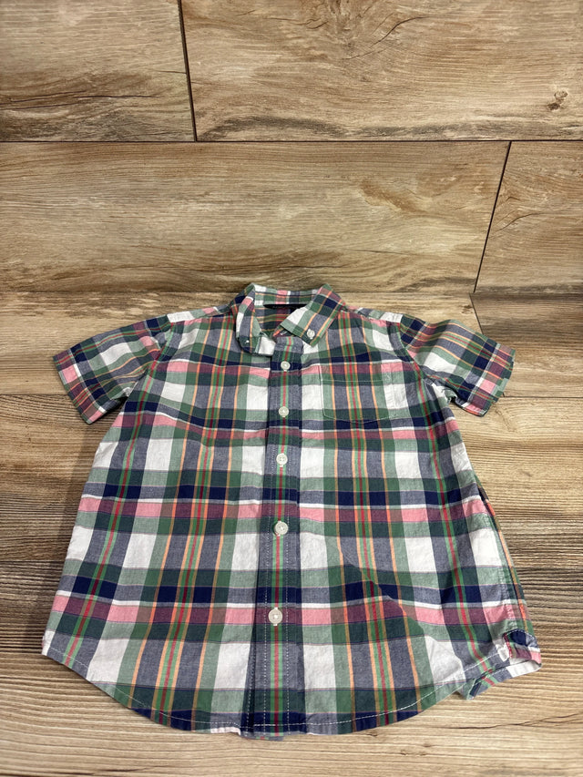 Top-down view of toddler short-sleeve green plaid button-down shirt size 5T showing buttons and collar on wood background