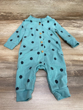 Flat lay of Cat and Jack green polka-dot coverall with wooden front buttons, crotch snaps, cuffed legs on wood background