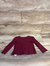 Flat lay of Old Navy burgundy toddler waffle-knit long-sleeve shirt size 3T showing textured knit and scalloped hem on wood background