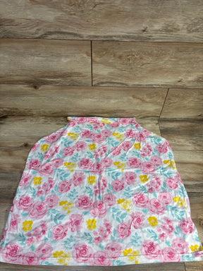 Floral baby blanket with pink, yellow flowers and green leaves on wood background