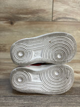 Sole view of Nike Force 1 TD Strawberry Banana sneakers size 5c showing white circular tread pattern and Nike branding on wood plank floor