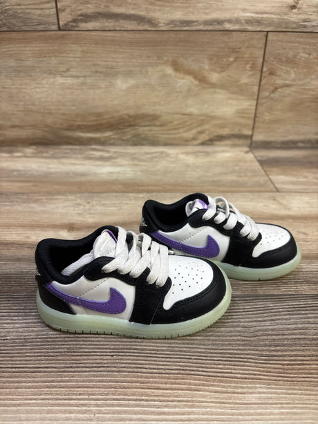 Front and side view of Air Jordan 1 Retro Low OG TD Black Raspberry sneakers with purple Swooshes on a wood floor