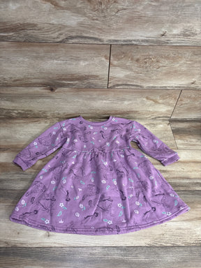 Long sleeve purple toddler dress with floral and princess print, displayed on wood floor