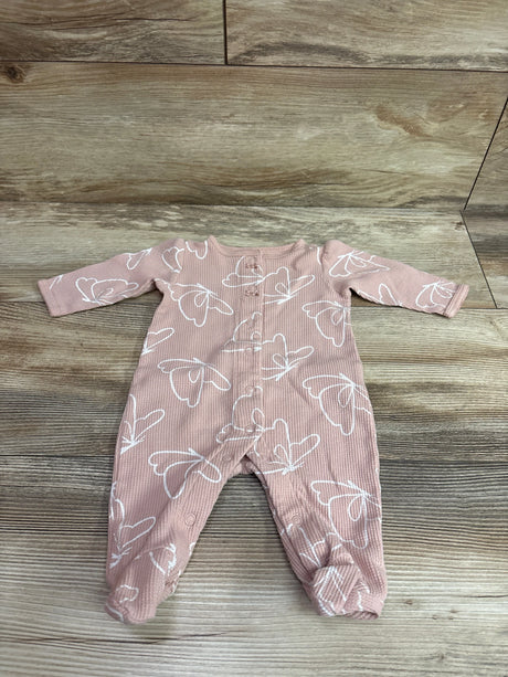 Front view of Carter’s waffle knit snap sleeper showcasing pink fabric, white butterfly print, long sleeves, and snap closures on a wood background