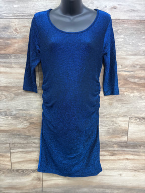 Shimmery blue fitted dress with three-quarter sleeves on mannequin, wood background