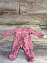 Front view of Carter’s Little Sister pink footed sleeper in size 3 months with floral print and zipper on wood floor