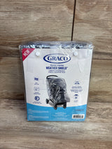 Front of Graco Weather Shield packaging showing clear rain cover on stroller, wood background