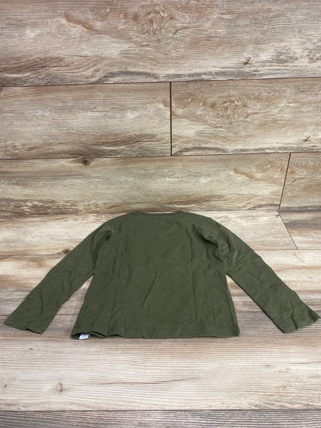 Back view of green Baby Gap x Disney Mickey Mouse long sleeve shirt in size 5T on a wood-look background