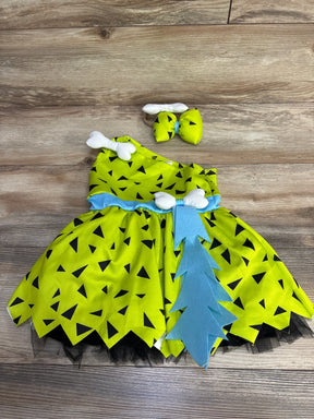 Bright green toddler Flintstones costume with black triangles, blue accents, and bone details