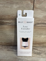 Belly Bandit Luxe Extender packaging for belly wrap extender on wood background