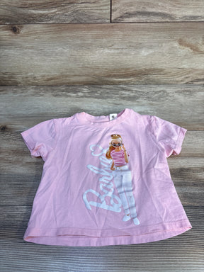 Light pink Barbie graphic girls' T-shirt with character print, kids clothing flat lay