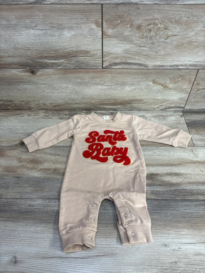 Beige baby onesie with red 'Santa Baby' embroidery, long sleeves, snap closures, laid on wood floor