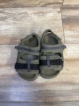 Top-down view of Zara scuba toddler sandals in olive green, size 7C, showing two adjustable Velcro straps and mesh upper on wood floor