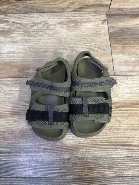 Top-down view of Zara scuba toddler sandals in olive green, size 7C, showing two adjustable Velcro straps and mesh upper on wood floor