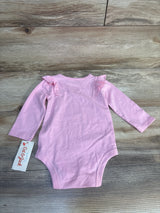 Pink long sleeve baby bodysuit with ruffle shoulders, Cat & Jack tag, on wood floor