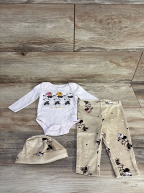 Infant outfit set including long-sleeve bodysuit with Minnie Mouse prints, beige Minnie Mouse leggings, and matching hat on wood floor
