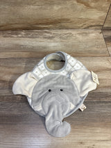 Front view of Emerson elephant bib showing plush grey elephant face and trunk with cream patterned top on wood floor