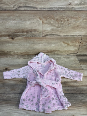 Pink baby robe with silver stars and hood on wood background